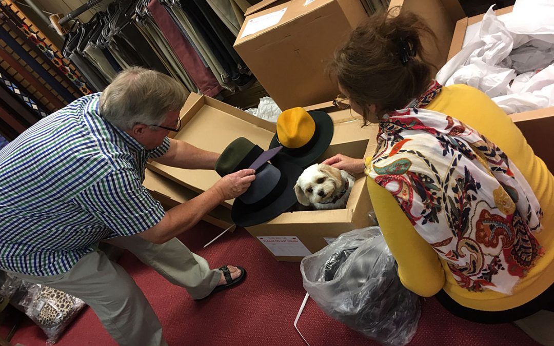 Roger Sue unpacking hats Tuppence