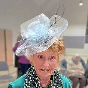 Trying on fascinator in Hat Talk at Charminster WI, Hat Talks by Sue, for T Snook hatters of Bridport
