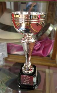Bridport Christmas Cheer 2022 Best Shop Window trophy. awarded to T Snook, hat shop