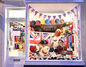 Coronation window display for May 2023 at T Snook, hat shop of Bridport Dorset