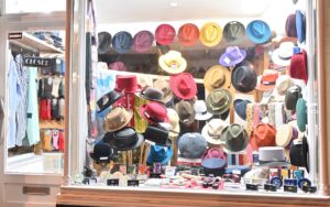 October 2023 display window #32 at T Snook hat shop in Bridport Dorset