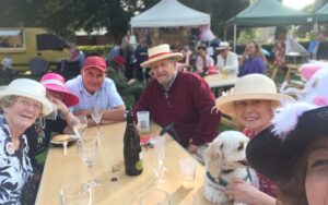 Owners, staff & friends of T Snook, hat shop in Dorset UK, during Bridport Hat Festival 2023