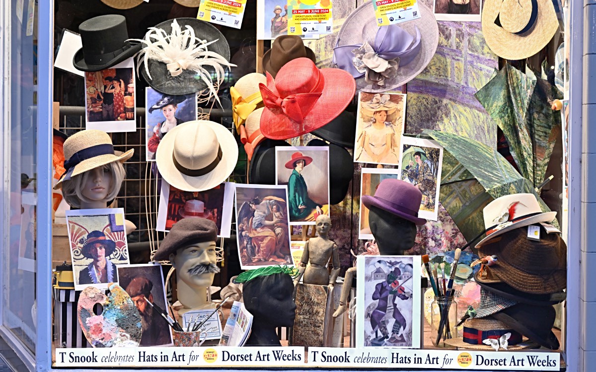 'Hats in Art' window display for Dorset Art Weeks 2024 at T Snook, hat shop in Bridport, Dorset, England UK