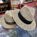 Two seagrass summer hats at T Snook, hat shop in Bridport, Dorset, England