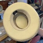 Underside of seagrass Gambler-style summer hat at T Snook, hat shop in Bridport, Dorset, England