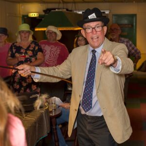 Auctioneer for Bridport Hat Festival, Jim Rowe