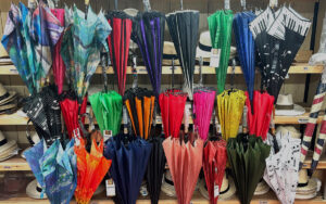 Umbrellas at T Snook, hat shop in Bridport, Dorset, England