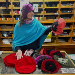 Wool flower cloches and tucked berets at T Snook, hat shop in Bridport, Dorset, England