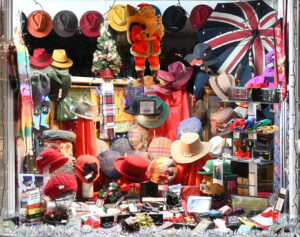 December 2024 entry-side display window at T Snook, hat shop in Bridport, Dorset, England