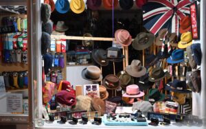 January 2025 entry-side display window at T Snook, hat shop in Bridport, Dorset, England