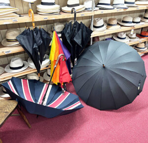 Men's umbrellas at T Snook, hat shop in Bridport, Dorset, UK