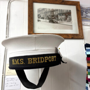 HMS Bridport, Royal Navy sailor's cap (not for sale), at T Snook, hatters of Bridport, Dorset, UK