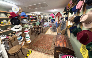 Ladies' hats in rear of No.30, at T Snook, hat shop in Bridport, Dorset, UK